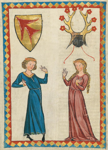 Miniature from a late-medieval manuscript showing a young man and woman in individual dancing pose. Both are wearing long gowns, his blue, hers red. Both have long, curly blonde hair (his chin-length, hers hip-length), wearing a wreath of orange-ish flowers on their head. Over his head is situated a coat of arms with a red arrow-like shape on gold, pointed at the top left, over her head a closed helmet facing the viewer, adorned with four-pointed antlers on whose tips are growing red flowers.